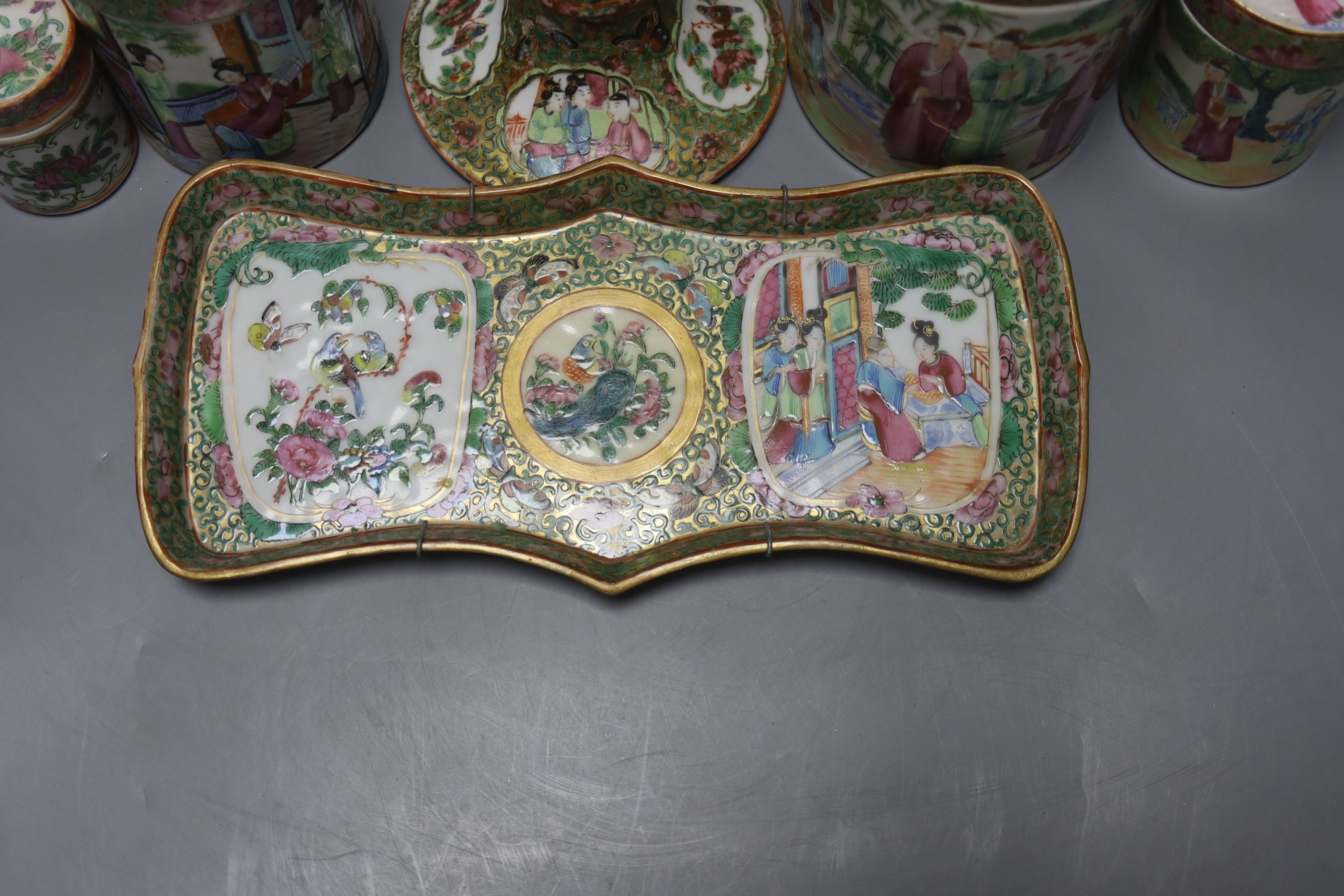 A Chinese Canton famille rose nest of boxes and covers, a similar candlestick and a tray 23cm